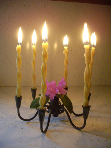 table top metal candle holder with 6 lighted candles