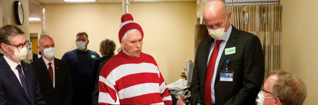 Where's VP pence no mask in where's waldo stripes meeting w masked people in suits