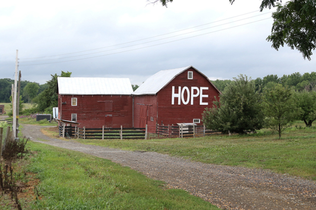 red barn with large  white  letters HOPE