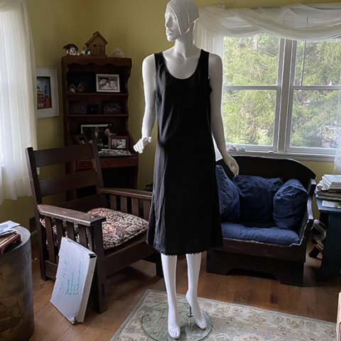 unpainted mannequin in black sheath